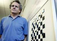 Jonathan Shaeffer with a checkers board after